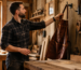 a man taking off Best Leather Aprons for Woodworkers from the hook.