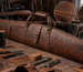 Detailed leather gun case with visible stitching, thread spools, and tools, highlighting the importance of Gun Case Stitching.